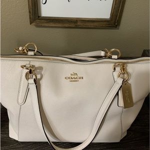 Cream Coach satchel with gold details